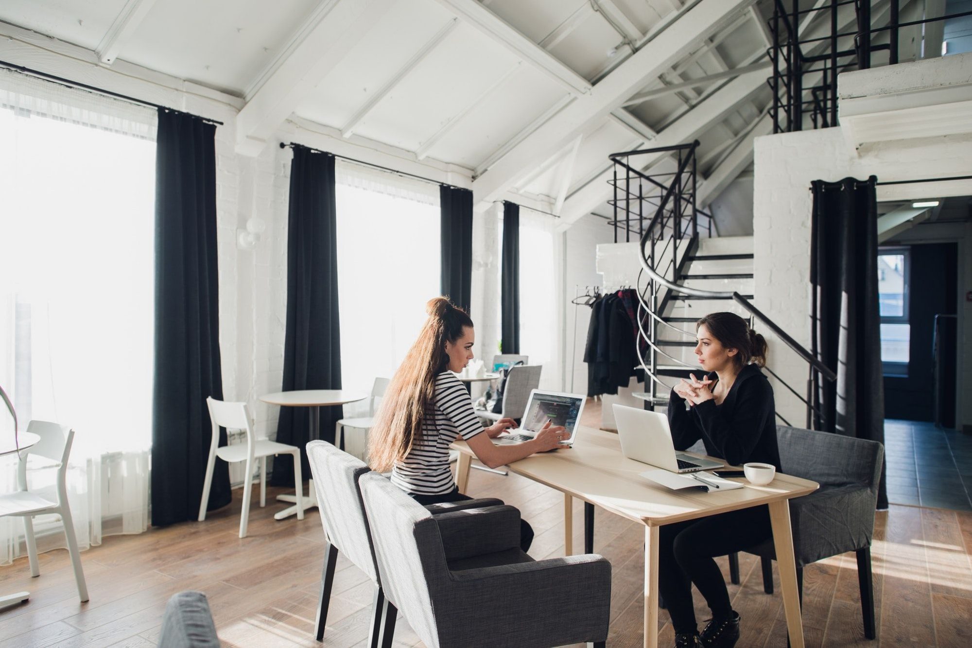 Young architect student being interviewed for job in design company,having conversations about